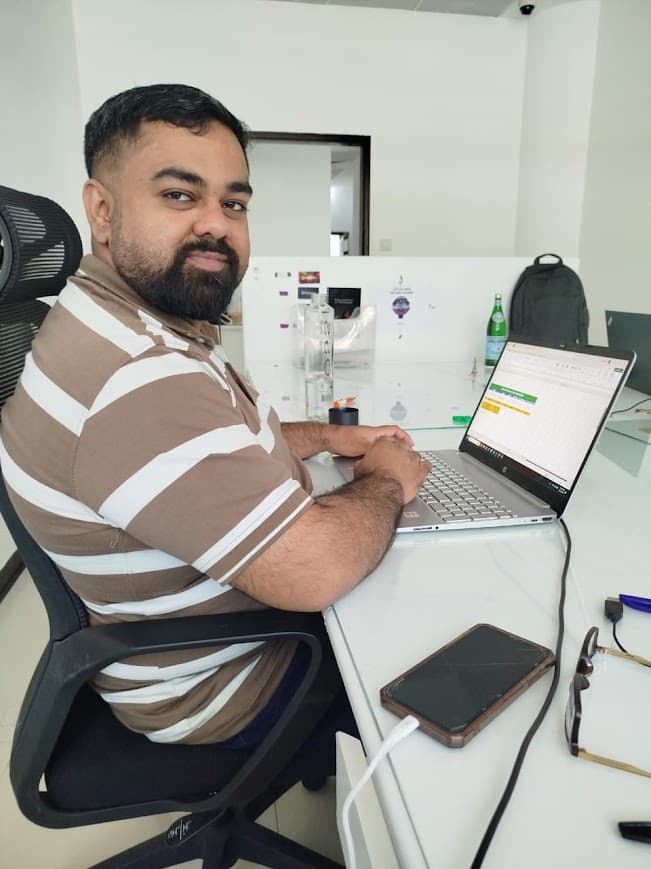 Mohsin Ali working at his desk